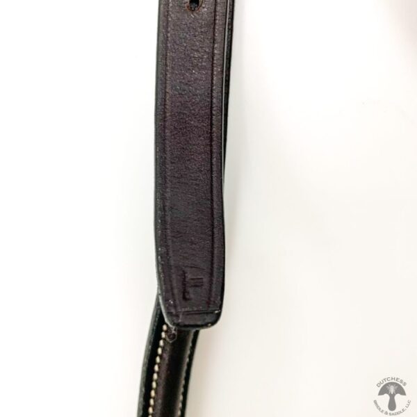 A close up of the strap on a camera