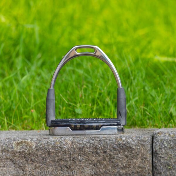 A close up of a horse shoe on the ground