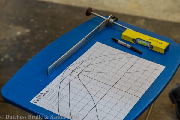 A blue table with a paper and a pencil