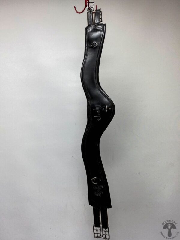 A black metal sculpture of a curvy body.