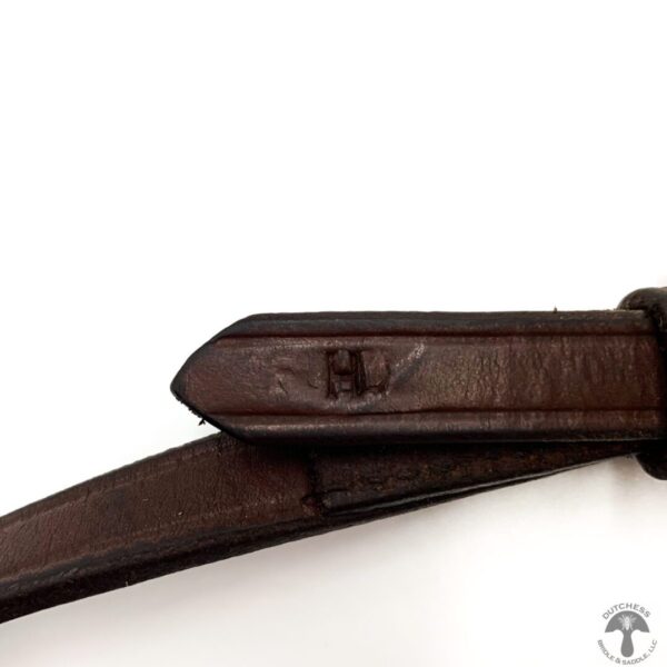 A close up of the strap on a brown belt