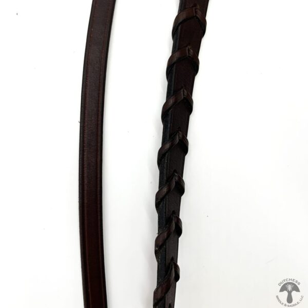 A pair of brown leather leashes on a white background