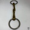 A close up of a horse bit with a ring