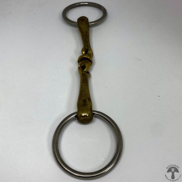 A close up of a horse bit with a ring