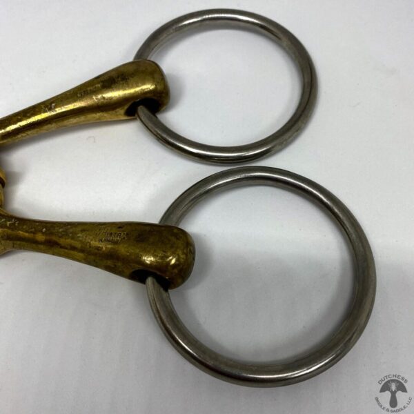 A pair of scissors with one metal ring.