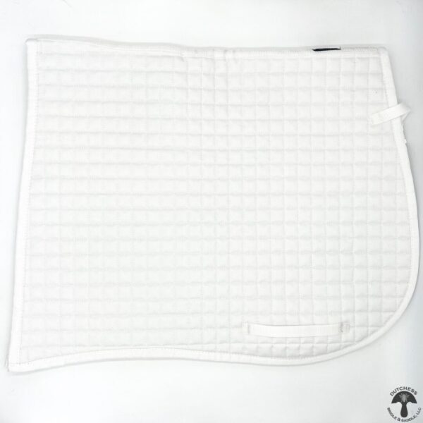 A white blanket with squares on it