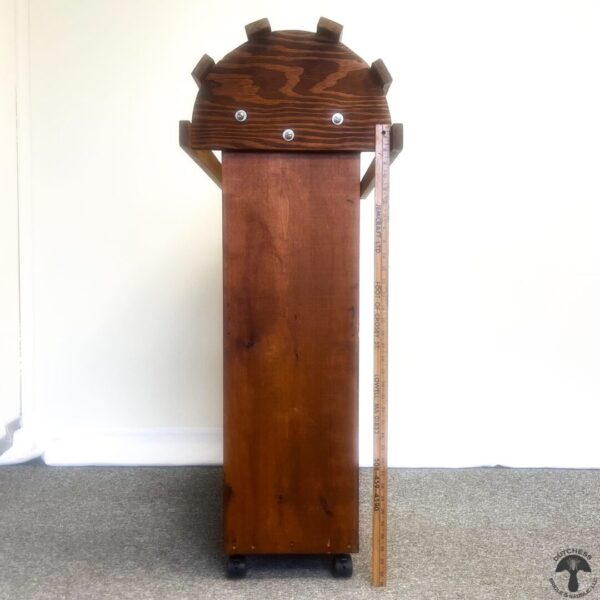 A wooden stand with a clock on top of it.