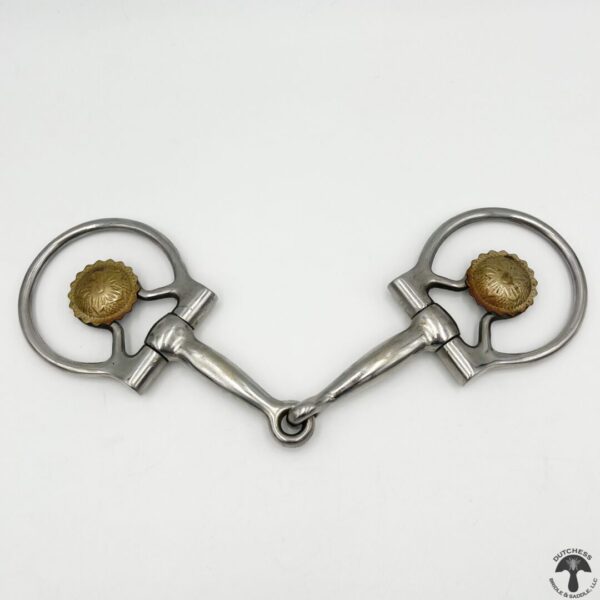 A pair of metal horse bit with two brass balls.