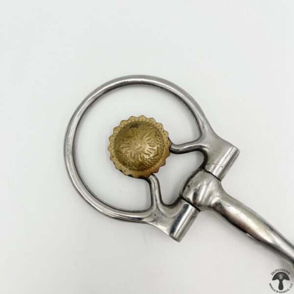 A bottle opener with a beer cap on it.