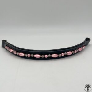 A black and pink horse bridle with beads on it.