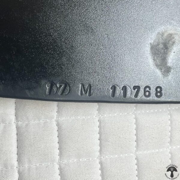 A close up of the number 1 7 m on a mattress