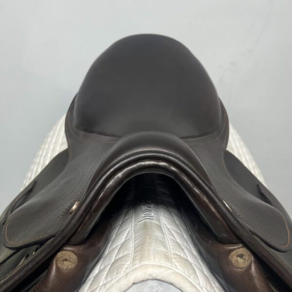 A close up of the saddle on a horse