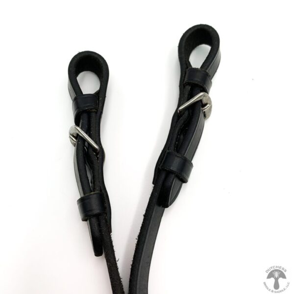 A pair of black leather cords with metal clasps.