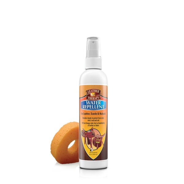 A bottle of air freshener next to an orange donut.