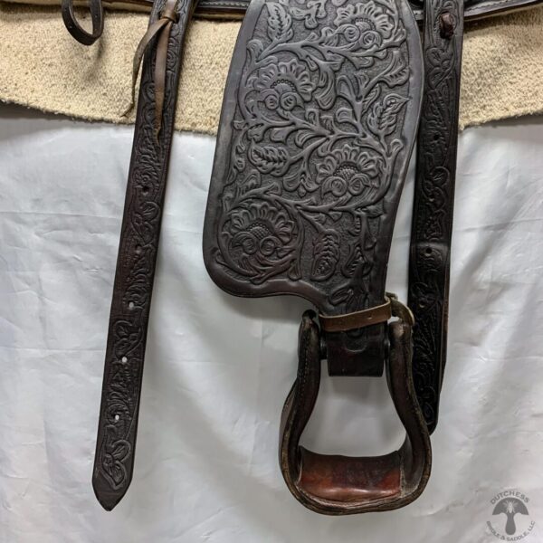 A close up of the leather strap on a horse