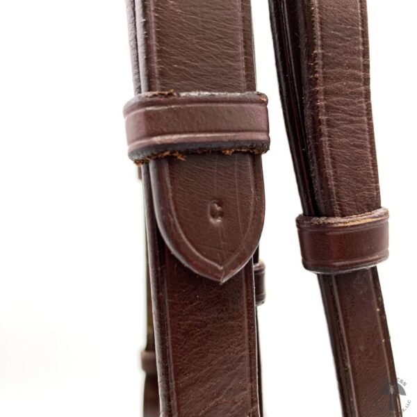 A close up of the strap on a horse