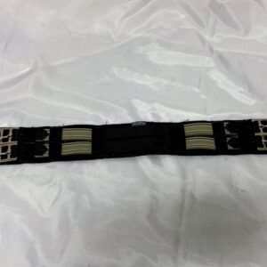 A black and white belt on top of a bed