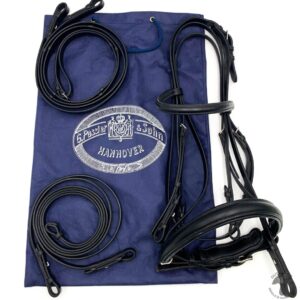 A blue bag with some black leather bridles