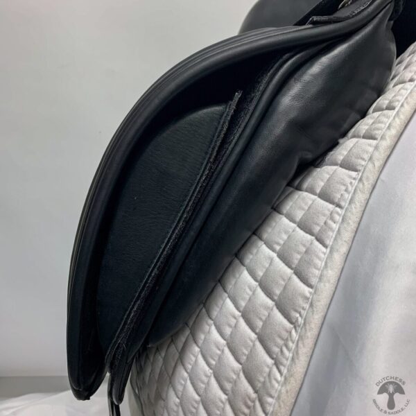 A close up of the saddle on a horse