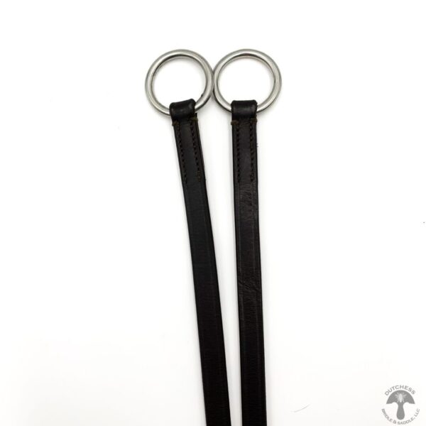 A pair of black leather straps with silver o-rings.