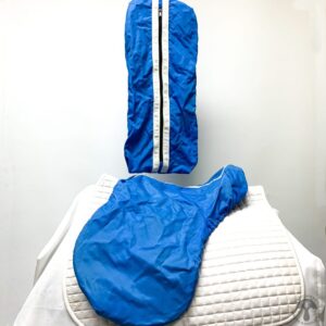 A blue bag sitting on top of a white chair.