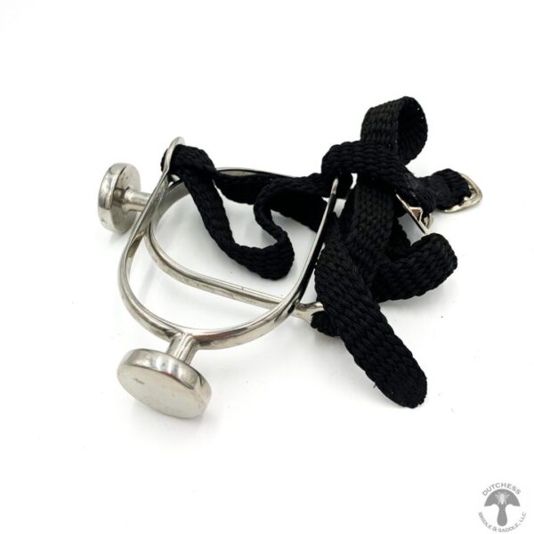 A stethoscope is laying on top of a black strap.