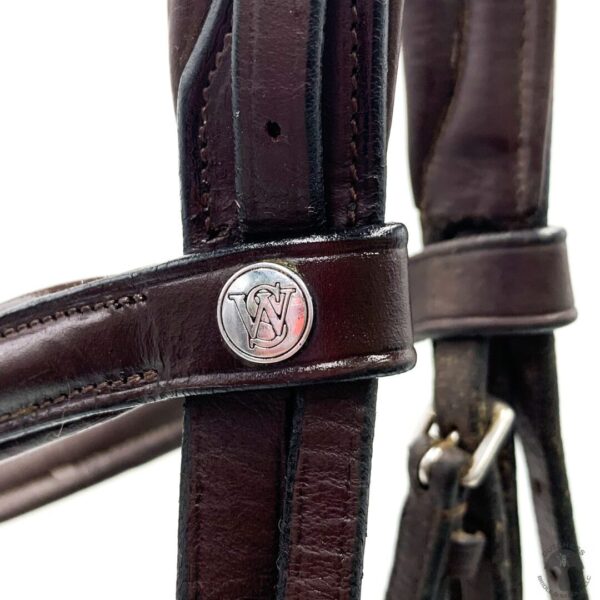 A close up of the leather on a horse 's bridle.