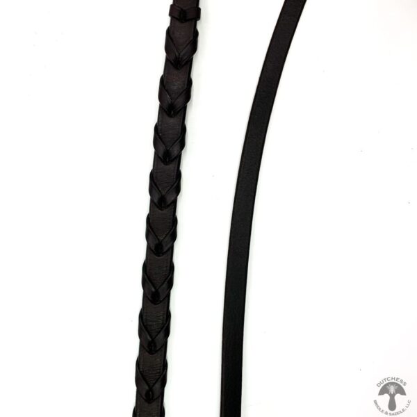 A black leather strap with a long black cord.