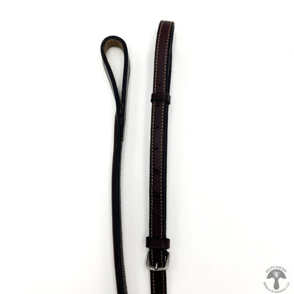 A pair of brown leather straps and a black strap.