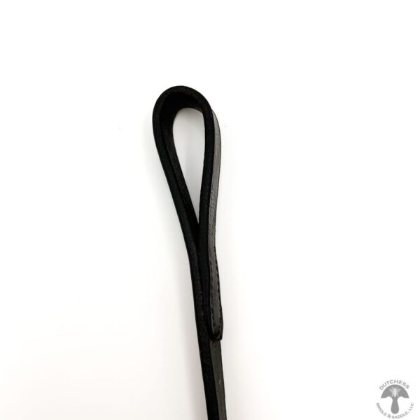 A black leather strap is bent to the side.