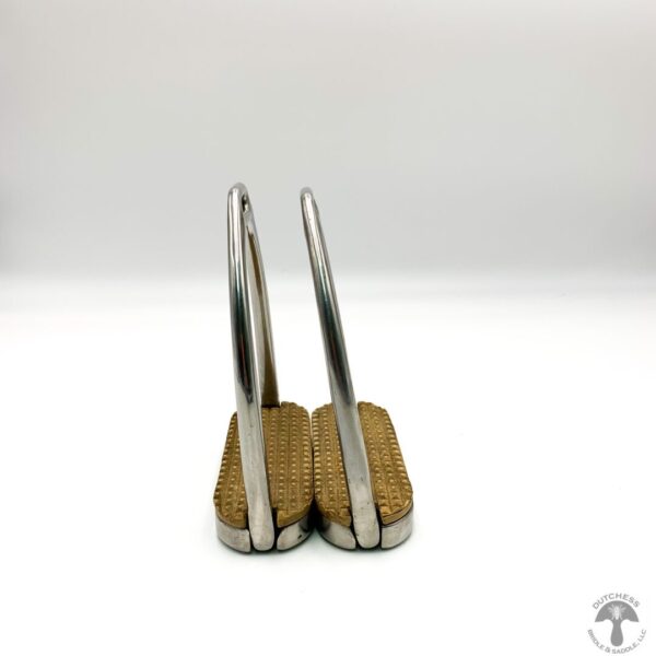 A pair of metal and wood bookends on top of each other.