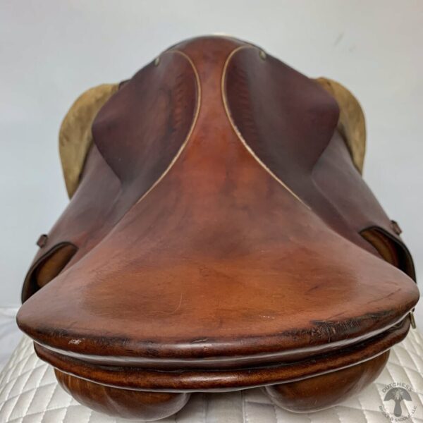 A close up of the saddle on a horse.