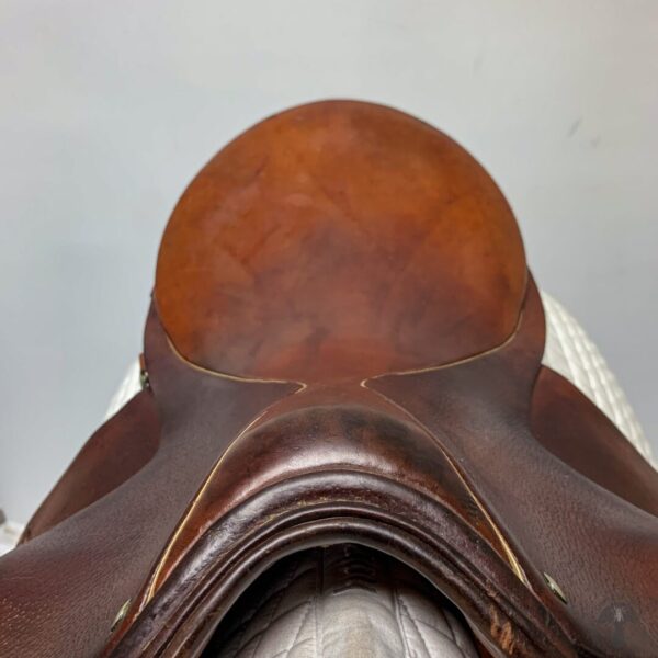 A close up of the saddle on a horse