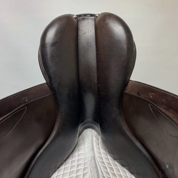 A close up of the saddle on a horse.