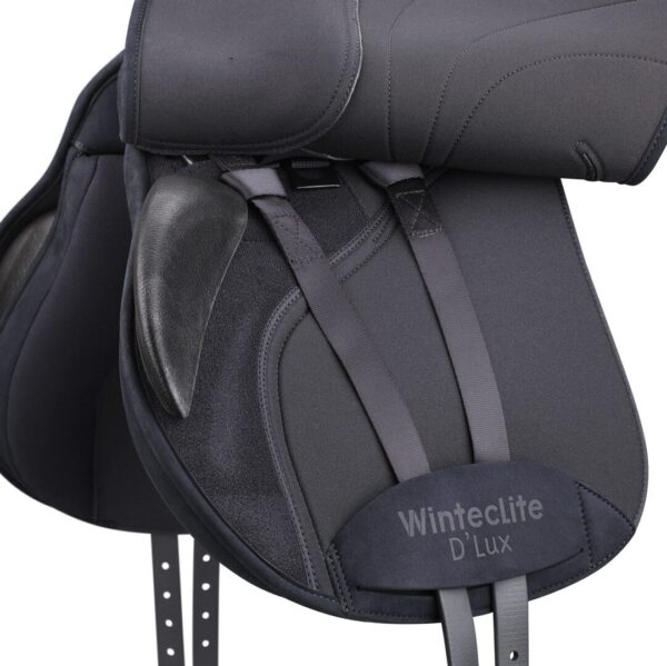 A close up of the seat on a black saddle