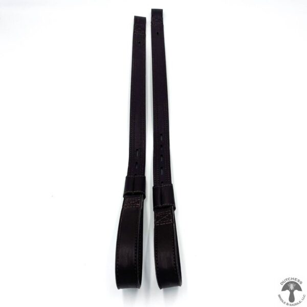 A pair of black straps on top of a white background.