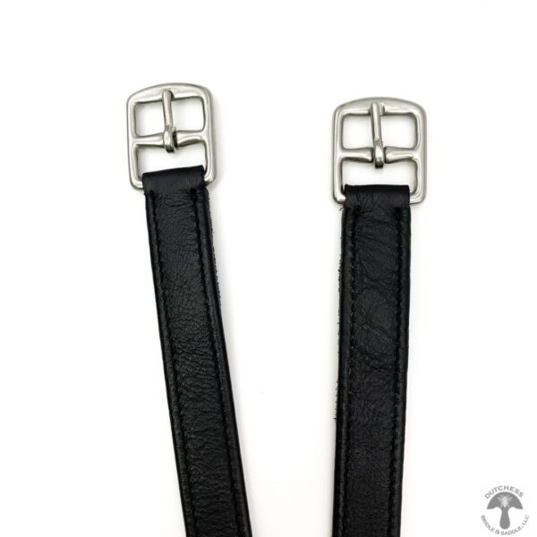 A pair of black leather straps with silver buckles.