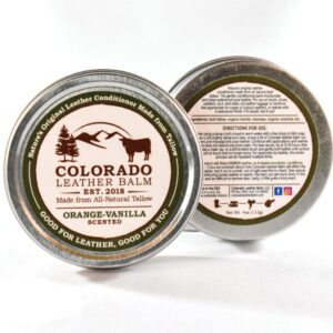 A close up of the back and front of a tin of colorado leather balm