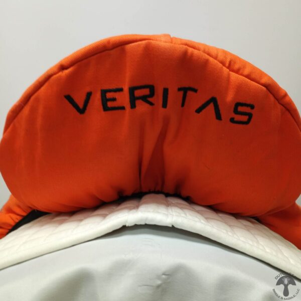 A close up of the back end of an orange hat.