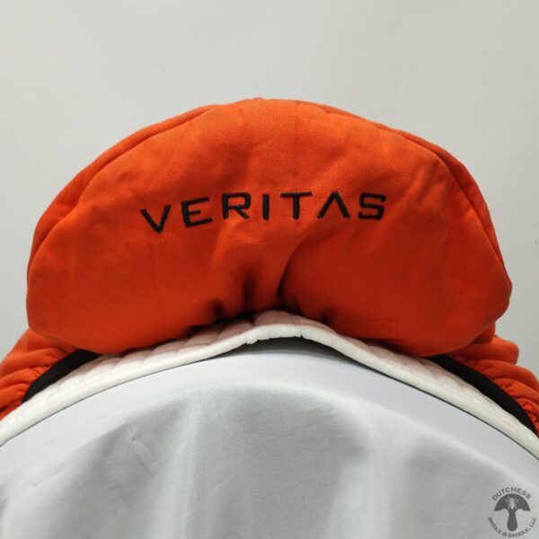 A close up of the back end of an orange hat.